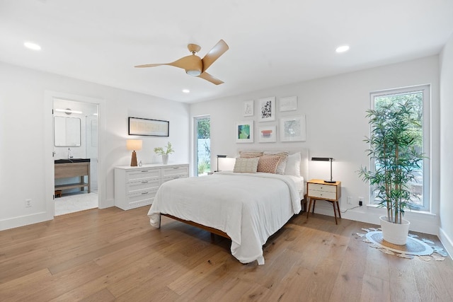 4405 Greystone Dr, Austin, TX 78731 - bedroom with multiple windows, light wood finished floors, recessed lighting, and ceiling fan