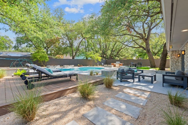 4405 Greystone Dr, Austin, TX 78731 - view of pool featuring outdoor lounge area, a wooden deck, and a fenced backyard