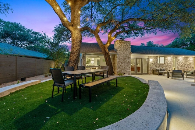 4405 Greystone Dr, Austin, TX 78731 - rear view of property featuring french doors, stone siding, a chimney, a fenced backyard, and a patio area