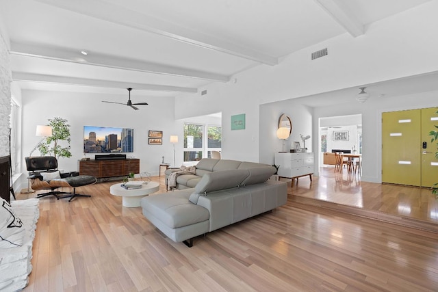 4405 Greystone Dr, Austin, TX 78731 - living room with beam ceiling, light wood-style floors, and a ceiling fan