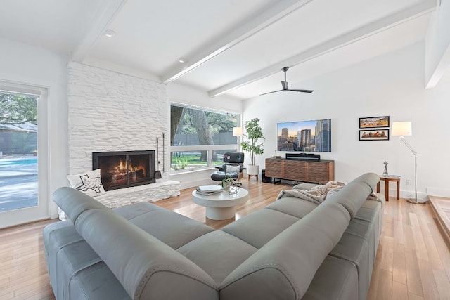 4405 Greystone Dr, Austin, TX 78731 - living room with beam ceiling, healthy amount of natural light, and wood finished floors
