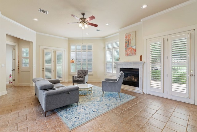 2800 Waymaker Way Unit 63, Austin, TX 78746 - living area with a ceiling fan, stone tile floors, recessed lighting, a glass covered fireplace, and ornamental molding