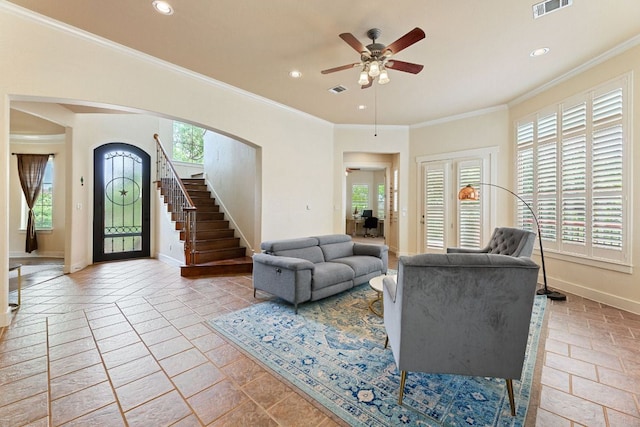2800 Waymaker Way Unit 63, Austin, TX 78746 - living room with stairs, arched walkways, ceiling fan, recessed lighting, and stone tile floors