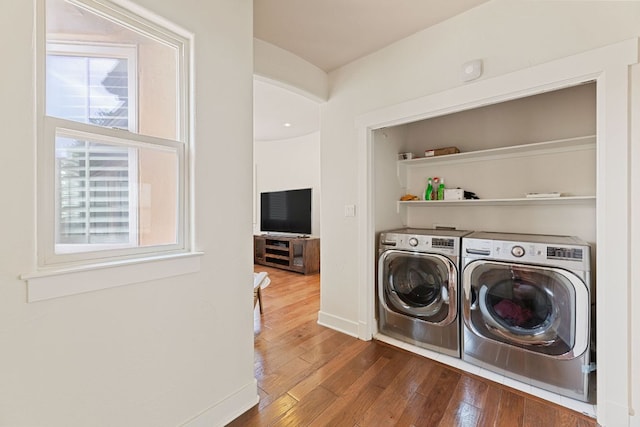 2800 Waymaker Way Unit 63, Austin, TX 78746 - laundry room featuring washing machine and clothes dryer and hardwood / wood-style floors
