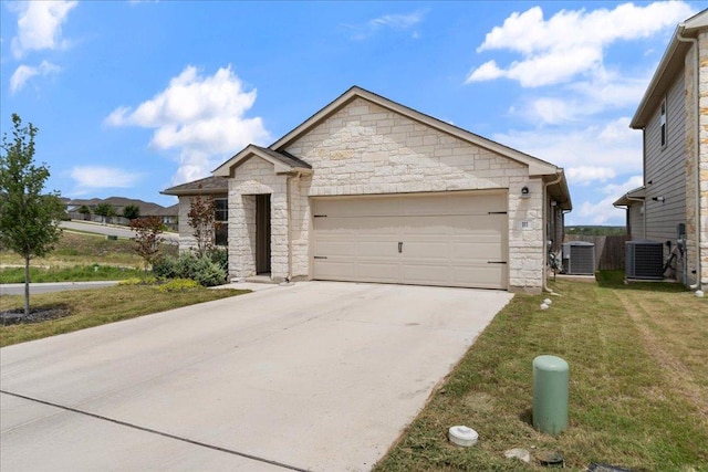 111 El Capitan Loop, Dripping Springs, TX 78620 - view of front of home with stone siding, driveway, a garage, and a front yard