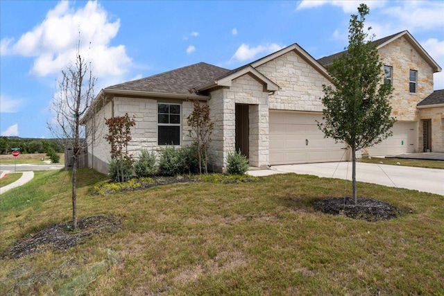 111 El Capitan Loop, Dripping Springs, TX 78620 - view of front of house featuring driveway, stone siding, a front lawn, and an attached garage