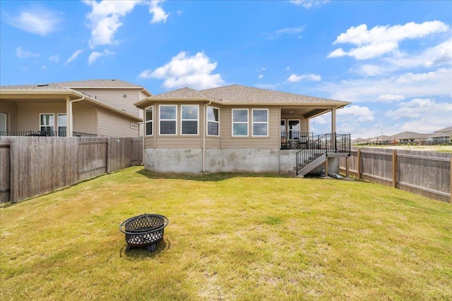 111 El Capitan Loop, Dripping Springs, TX 78620 - rear view of house with a fenced backyard and stairway