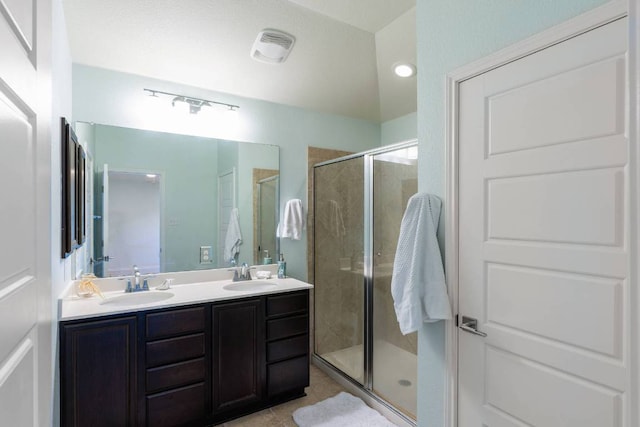404 Buttercup Creek Blvd Unit 19, Cedar Park, TX 78613 - full bathroom featuring a shower stall, double vanity, and tile patterned floors