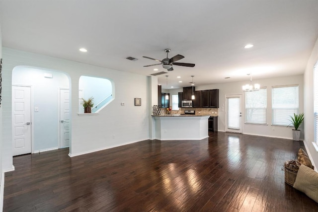404 Buttercup Creek Blvd Unit 19, Cedar Park, TX 78613 - unfurnished living room featuring ceiling fan, a chandelier, dark wood-style flooring, recessed lighting, and arched walkways