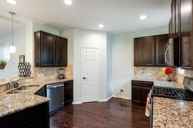 404 Buttercup Creek Blvd Unit 19, Cedar Park, TX 78613 - kitchen featuring appliances with stainless steel finishes, dark wood-type flooring, light stone counters, dark brown cabinetry, and recessed lighting