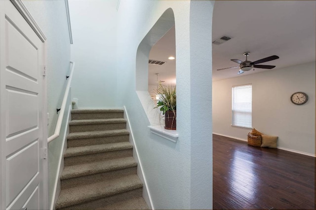 404 Buttercup Creek Blvd Unit 19, Cedar Park, TX 78613 - stairs with wood finished floors, arched walkways, a ceiling fan, and recessed lighting