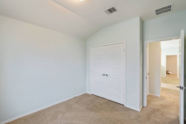 404 Buttercup Creek Blvd Unit 19, Cedar Park, TX 78613 - unfurnished bedroom with light carpet, lofted ceiling, and a closet