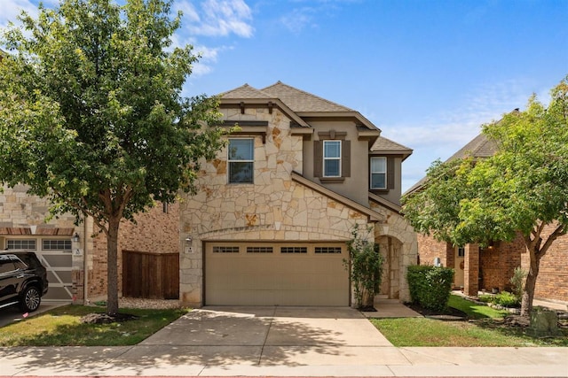 404 Buttercup Creek Blvd Unit 19, Cedar Park, TX 78613 - view of front of property with stone siding, driveway, and an attached garage