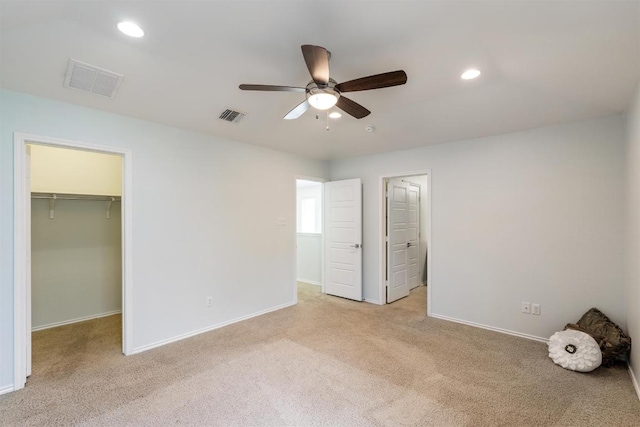 404 Buttercup Creek Blvd Unit 19, Cedar Park, TX 78613 - unfurnished bedroom featuring a spacious closet, light carpet, recessed lighting, and a ceiling fan