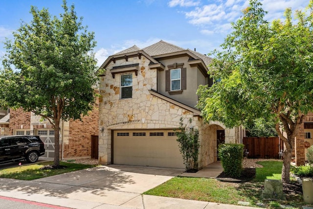 404 Buttercup Creek Blvd Unit 19, Cedar Park, TX 78613 - view of front of home with stone siding, driveway, an attached garage, and a shingled roof