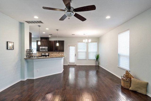404 Buttercup Creek Blvd Unit 19, Cedar Park, TX 78613 - kitchen with dark brown cabinetry, backsplash, healthy amount of natural light, dark wood finished floors, and recessed lighting