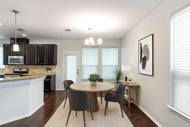 404 Buttercup Creek Blvd Unit 19, Cedar Park, TX 78613 - dining room with dark wood-type flooring and a chandelier