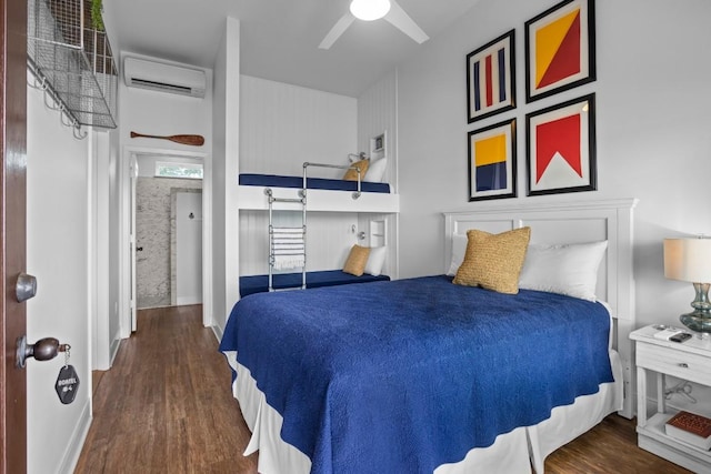4910 Owen Ln, Temple, TX 76502 - bedroom featuring a wall mounted AC, wood finished floors, and ceiling fan