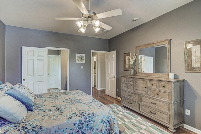 2712 Kickapoo Cavern Dr, Pflugerville, TX 78660 - bedroom with wood finished floors and a ceiling fan
