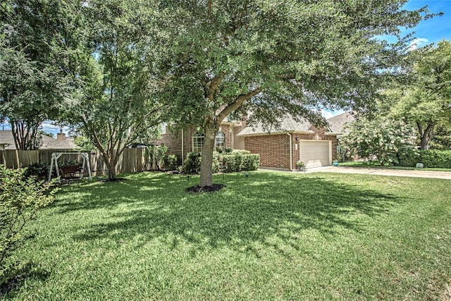 2712 Kickapoo Cavern Dr, Pflugerville, TX 78660 - view of property hidden behind natural elements with brick siding, concrete driveway, and a garage