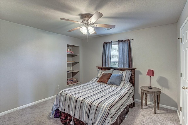 2712 Kickapoo Cavern Dr, Pflugerville, TX 78660 - carpeted bedroom with ceiling fan and a textured ceiling