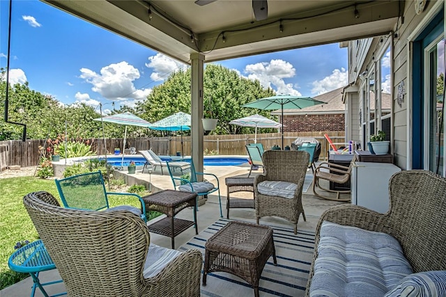 2712 Kickapoo Cavern Dr, Pflugerville, TX 78660 - fenced backyard with ceiling fan, a patio area, and an outdoor living space