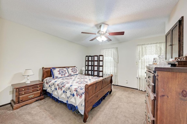 6606 Lancret Hill Dr, Austin, TX 78745 - bedroom with light carpet, a ceiling fan, and a textured ceiling