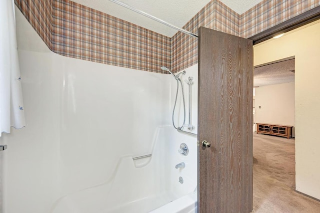 6606 Lancret Hill Dr, Austin, TX 78745 - full bath with a textured ceiling, bathing tub / shower combination, and wallpapered walls