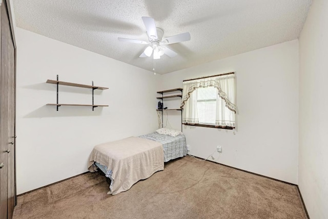 6606 Lancret Hill Dr, Austin, TX 78745 - bedroom featuring carpet, a textured ceiling, and a ceiling fan