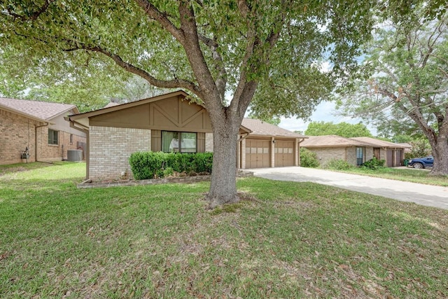 6606 Lancret Hill Dr, Austin, TX 78745 - view of front of property featuring concrete driveway, a garage, brick siding, and a front lawn
