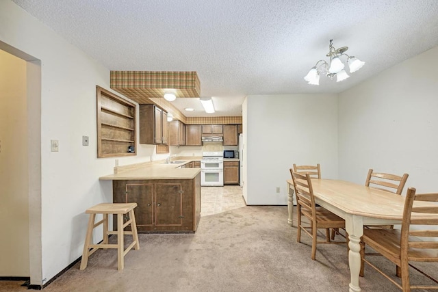 6606 Lancret Hill Dr, Austin, TX 78745 - kitchen featuring a chandelier, a textured ceiling, light colored carpet, light countertops, and stove