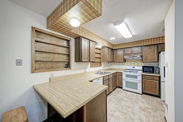 6606 Lancret Hill Dr, Austin, TX 78745 - kitchen with white appliances, open shelves, under cabinet range hood, a textured ceiling, and a peninsula