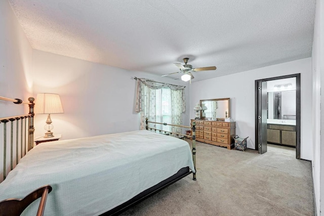6606 Lancret Hill Dr, Austin, TX 78745 - bedroom with light carpet, a textured ceiling, ceiling fan, and ensuite bathroom