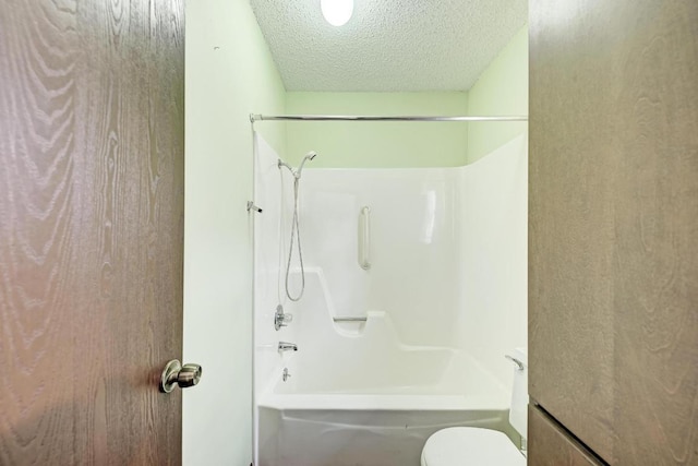 6606 Lancret Hill Dr, Austin, TX 78745 - full bathroom featuring a textured ceiling and shower / bath combination