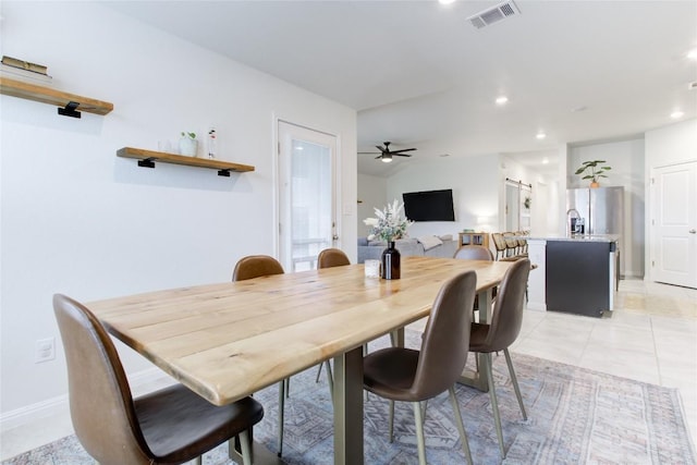 114 Creek Hollow Dr, Hutto, TX 78634 - dining area with recessed lighting, a barn door, and ceiling fan