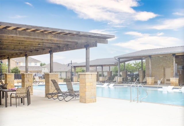 114 Creek Hollow Dr, Hutto, TX 78634 - community pool with a patio area