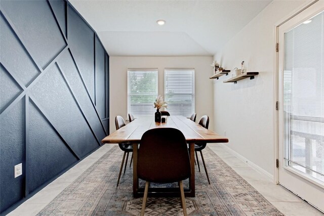 114 Creek Hollow Dr, Hutto, TX 78634 - dining room with light tile patterned floors, vaulted ceiling, and recessed lighting