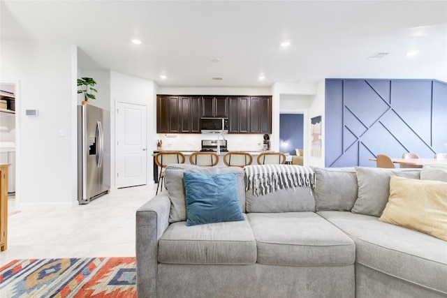 114 Creek Hollow Dr, Hutto, TX 78634 - living room featuring light tile patterned floors and recessed lighting