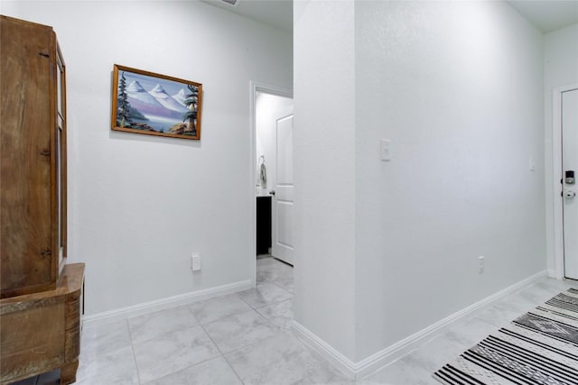 114 Creek Hollow Dr, Hutto, TX 78634 - hallway featuring light marble finish flooring