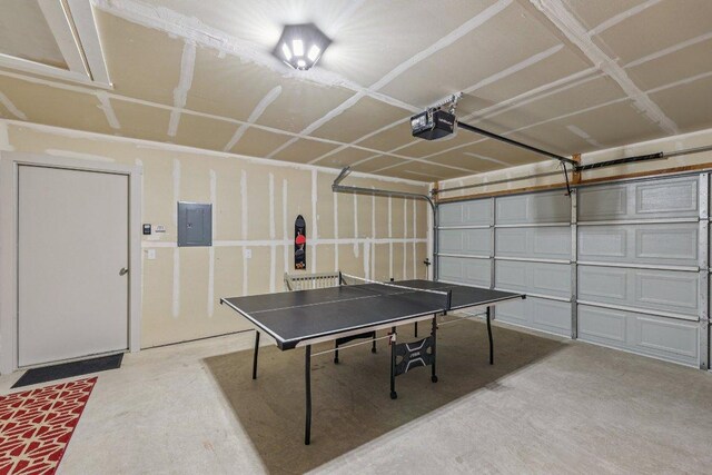 111 Krause Springs Dr, Hutto, TX 78634 - playroom featuring electric panel, concrete flooring, and a garage