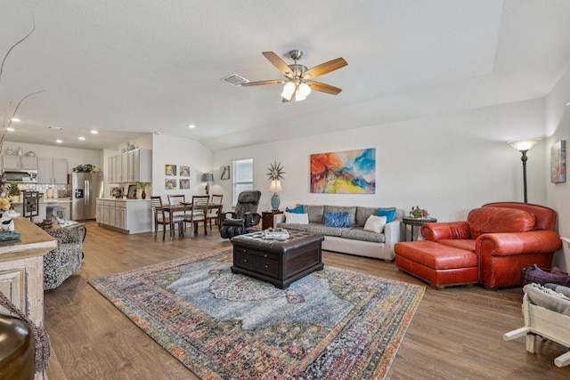 111 Krause Springs Dr, Hutto, TX 78634 - living room with ceiling fan, wood finished floors, recessed lighting, and vaulted ceiling