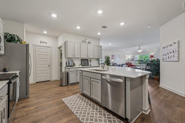 111 Krause Springs Dr, Hutto, TX 78634 - kitchen featuring stainless steel dishwasher, range with electric cooktop, gray cabinets, a ceiling fan, and dark wood finished floors