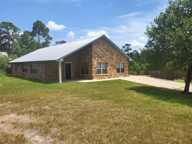 236 Makaha Dr, Bastrop, TX 78602 - rear view of house featuring a patio and stone siding