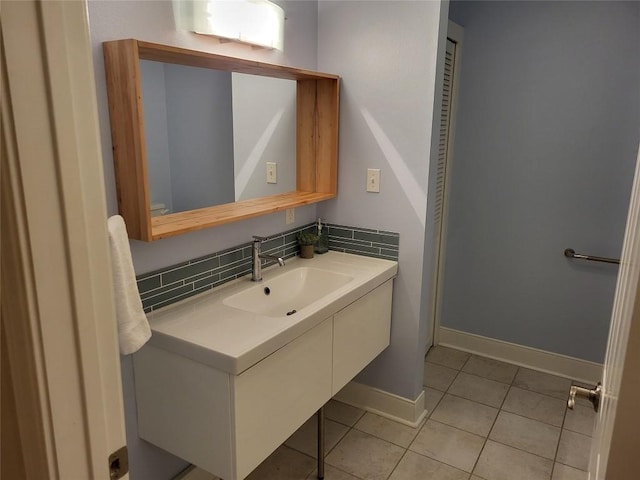 236 Makaha Dr, Bastrop, TX 78602 - bathroom featuring vanity, tile patterned floors, and decorative backsplash