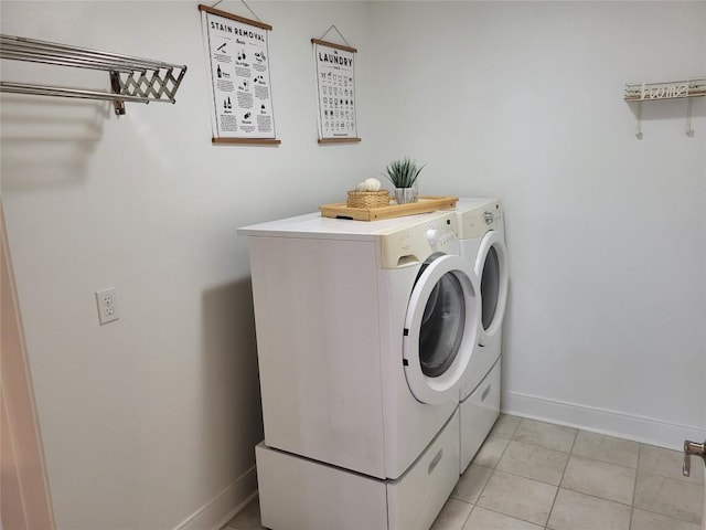 236 Makaha Dr, Bastrop, TX 78602 - washroom featuring washing machine and dryer and light tile patterned floors