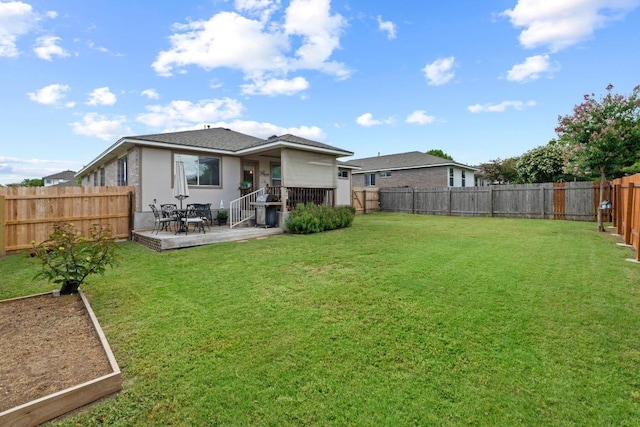 1111 Whitley Dr, Leander, TX 78641 - back of property with a vegetable garden, a patio, a fenced backyard, and stucco siding