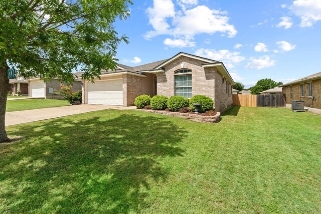 1111 Whitley Dr, Leander, TX 78641 - view of front of property featuring brick siding, concrete driveway, and a garage