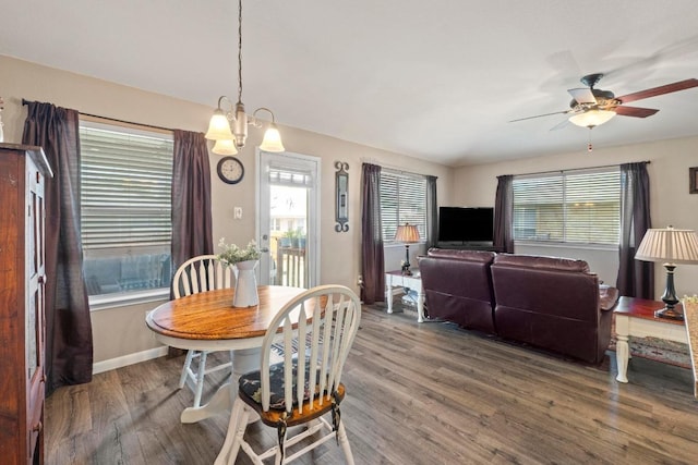 1111 Whitley Dr, Leander, TX 78641 - dining room featuring wood finished floors, a ceiling fan, and a chandelier
