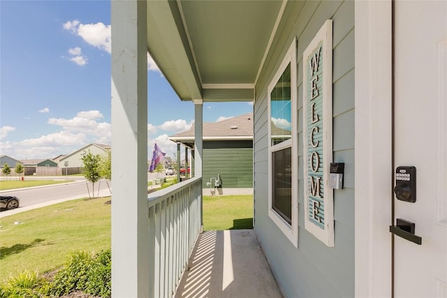 504 N Thunderstorm Ave, Lockhart, TX 78644 - covered porch with a lawn