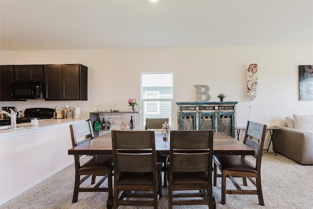 504 N Thunderstorm Ave, Lockhart, TX 78644 - dining room with light colored carpet